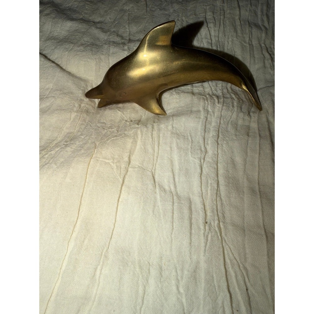 Vintage brass dolphin 5" long with patina